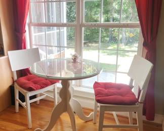 Beautiful bistro table white with red cushions