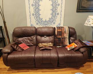 Beautiful all leather sofa with recliners on both ends