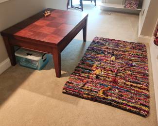 Lovely checkerboard would coffee table and hooked rug
