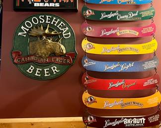 Moosehead Beer sign  and  Leinenkugels's 10 hanging canoe beer menu signs 