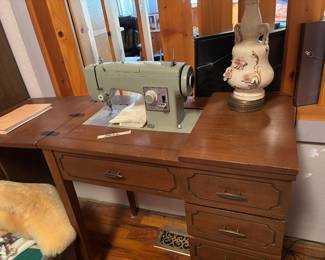 Sewing machine and cabinet