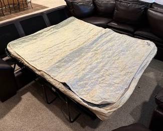 Gorgeous Leather Sectional by Peter's Billiards with Ottoman/Trunk and inflatable full-sized sofa bed.