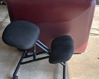 An ergonomic kneeling chair and massage table