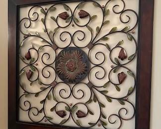 Framed Metal Wall Decor featuring a floral and scrollwork design.