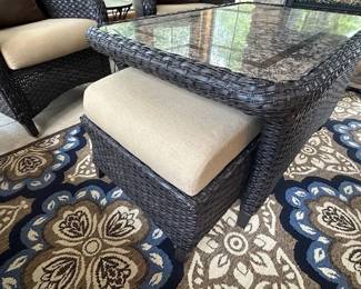 2 Sunbrella Ottomans that fit perfectly under the coffee table.  This is sold as a set- 2 Chairs, Coffee Table and Ottomans.