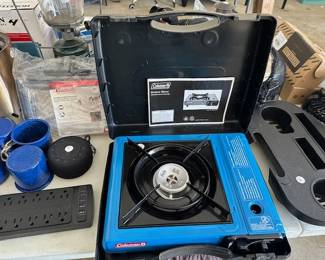 Coleman Tabletop Portable Butaine Gas Camping Stove, single burner and other camping supplies.