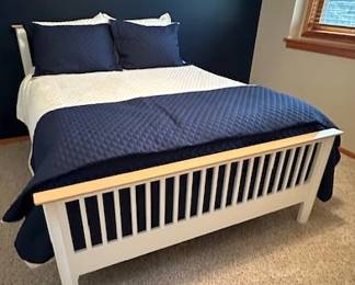 Queen-sized bed (includes mattresses), bedding sold separately.