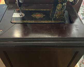 Antique Singer sewing machine in original cabinet