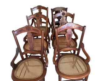 Walnut cane bottom chairs in excellent conditions. Beautiful carving.