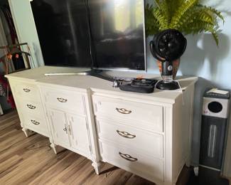 nice buffet/dresser, tv, decor