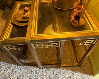 Brass and glass nesting tables from the side