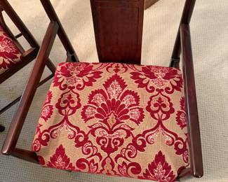 Asian upholstered chair that matches table and hutch