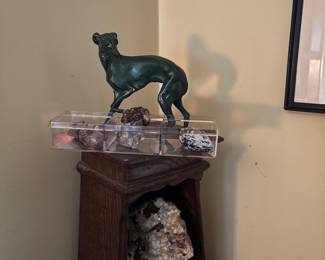 Bronze dog statue and crystal geodes