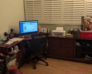 Corner computer desk with plenty of counter space and storage. Computer and printer not for sale.