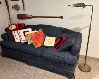 Cute vintage blue couch & assorted pillows.