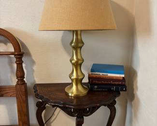 Brass lamp & side table with books about Ghosts & the Paranormal