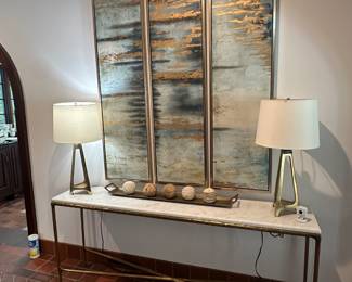 Marble and gold entry / sofa, table, lamps, and wall art