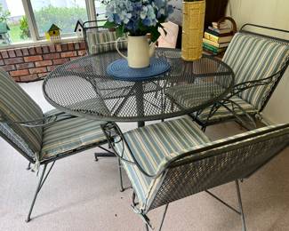 Wrought iron talks and 4 chairs with cushions 
