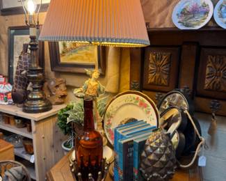 brass book ends, lamp, books, table