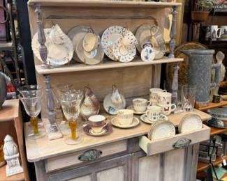 plates, cups, saucers, wooden hutch