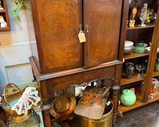 Wood cabinet, stuatuary, small green chair