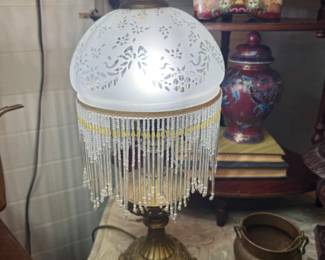 Beautiful Brass colored lamp with vintage looking globe and hanging beaded crystals