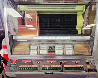 Completly restored  Seeburg VL200 Jukebox, also known as the Seeburg V-200 Select-O-Matic.  Currently has issue with button popping up after selection is made. Will need repair. Otherwise in excellent condition 