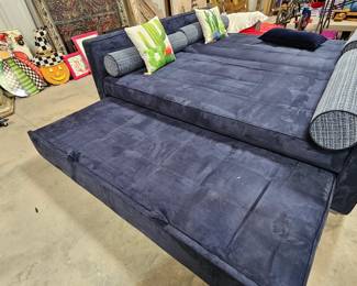 Two micro suede twin size trundle beds. Each bed is sold separately but does include its own trundle. Trundles pop up and make an even platform with the twin size bed . Could also be used as a couch with extra bed underneath it. Incredibly heavy 