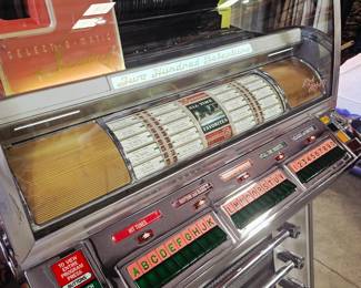 Completly restored  Seeburg VL200 Jukebox, also known as the Seeburg V-200 Select-O-Matic.  Currently has issue with button popping up after selection is made. Will need repair. Otherwise in excellent condition 