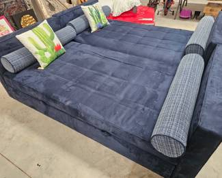 Two micro suede twin size trundle beds. Each bed is sold separately but does include its own trundle. Trundles pop up and make an even platform with the twin size bed . Could also be used as a couch with extra bed underneath it. Incredibly heavy 
