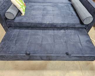 Two micro suede twin size trundle beds. Each bed is sold separately but does include its own trundle. Trundles pop up and make an even platform with the twin size bed . Could also be used as a couch with extra bed underneath it. Incredibly heavy 