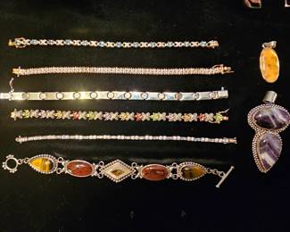 A few of the dozens of unique Sterling bracelets in this sale 