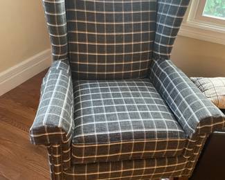 Upholstered grey modified wingback armchair