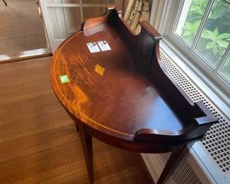 A Hepplewhite style Demilune table with inlaid wood by Baker Charleston Historic Mfg.