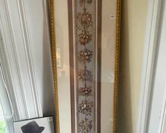 Framed photo of Frank Sinatra next to long framed print
