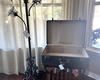 lamp, vintage suitcase and luggage rack
