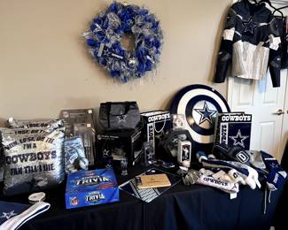 Dallas Cowboys memorabilia - pillows, blankets, games, clothes, kitchen items, and Christmas decor.