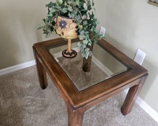 This is part of a three-piece set coffee table and two end tables, made by Lane. The one end table has a drawer in the bottom of it