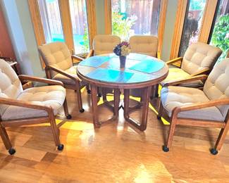 Kitchen nook table with 6 chairs, 3 leaves and pads.