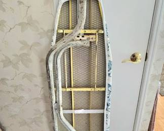 Vintage ironing board with cool metal frame base.