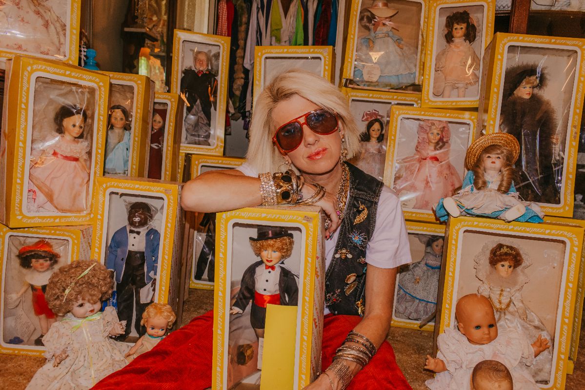 Owner of Estate Sales by Tara, Tara Daniel. Dolls in photo are not for sale