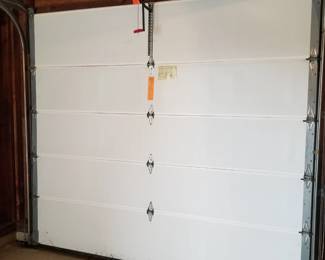 Nearly new insulated garage door 9' x 7'