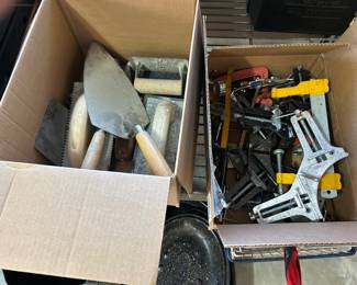 Masonry tools and box of clamps.