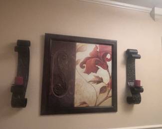 Metal sconces and large picture