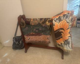 Quilt rack, lots of quilts