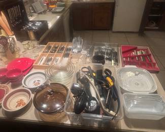 Several silverware sets, utensils, bowls, etc