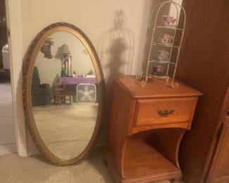 Small nightstand, Victorian tea decor and heavy oval mirror