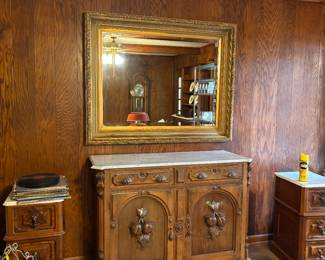 Large gold-rim wall mirror.   Antique chest with drawers and storage below marble top , 3 drawer side accent table 