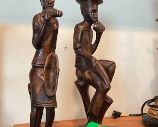 Hand carved wooden sculptures of man and woman 