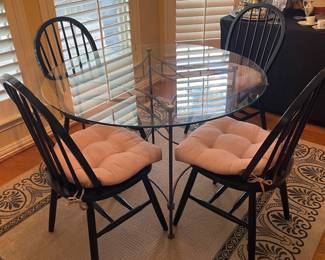 Glass top dining table and four chairs